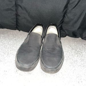black classic slip on vans.